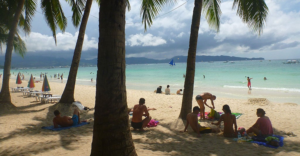 People lounging on Boracay's White Beach